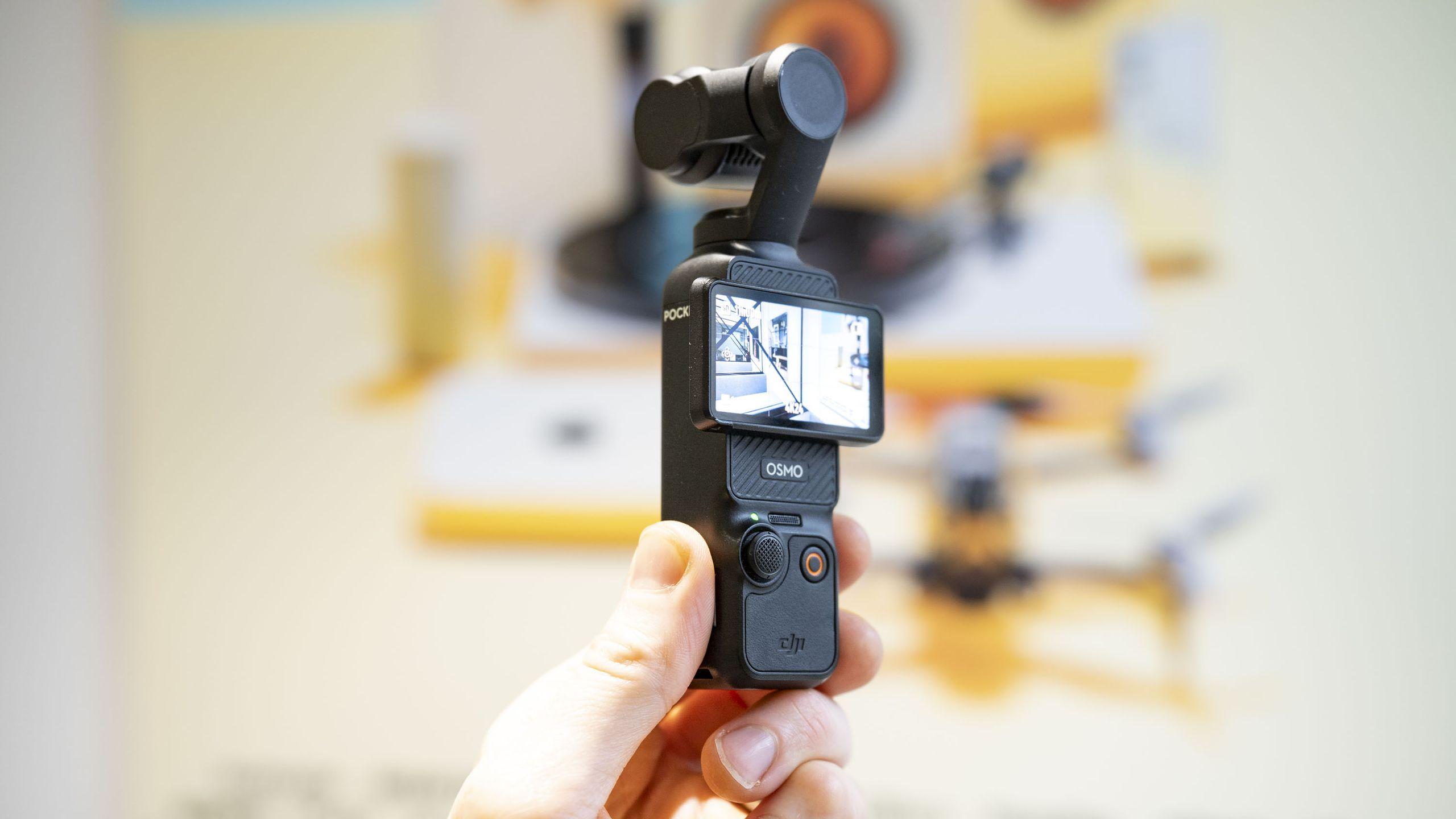 DJI Osmo Pocket 4 with gimbal accessories and wireless mic